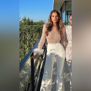 White bridal jumpsuit by Nadine Merabi